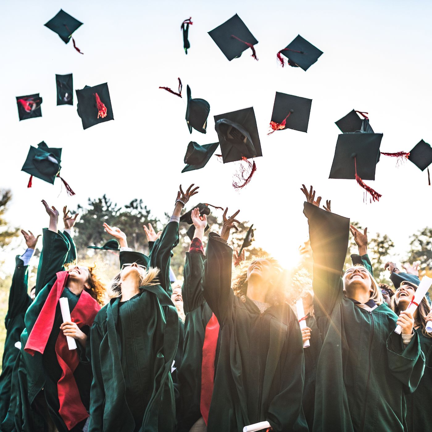 Graduates throw caps into the sky celebrating